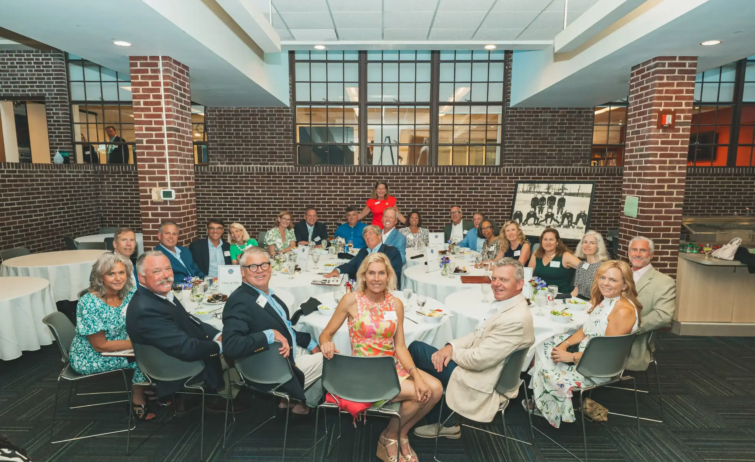 ULS Alumni sit together at an event.