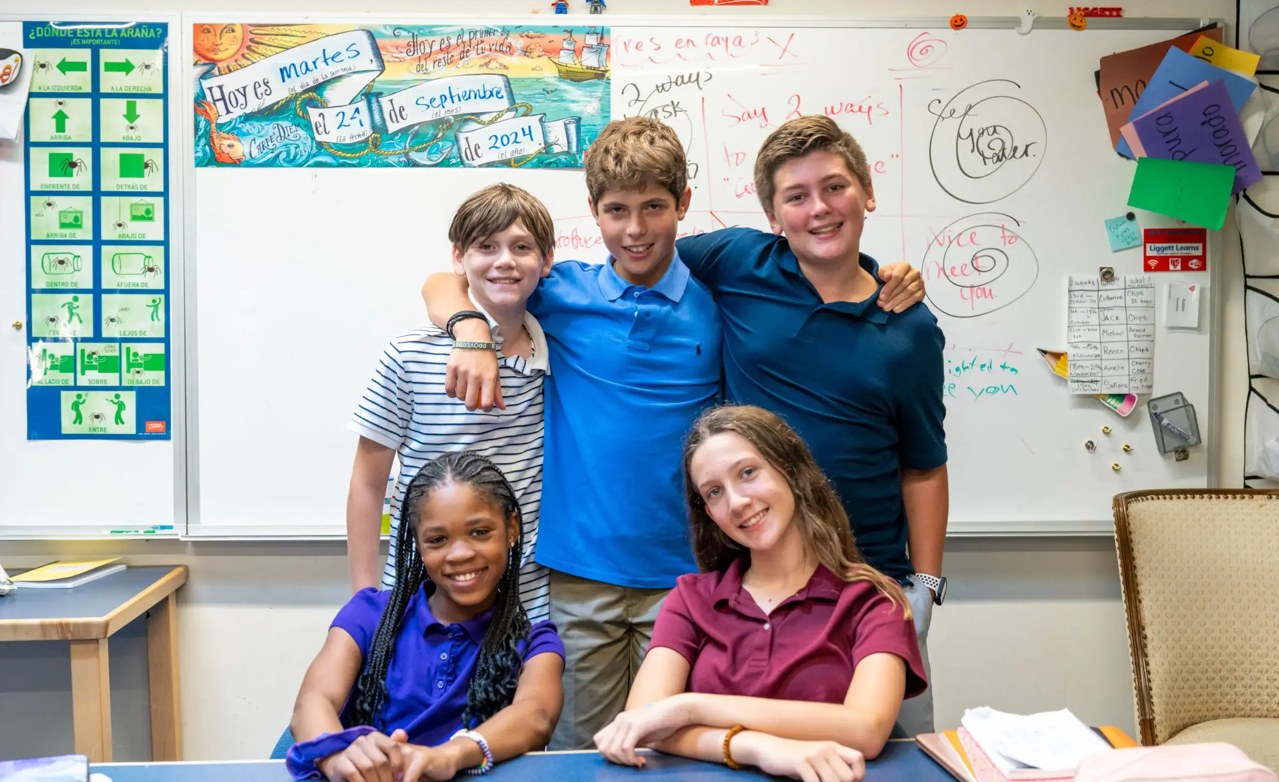 a group of Middle School students smile at the camera