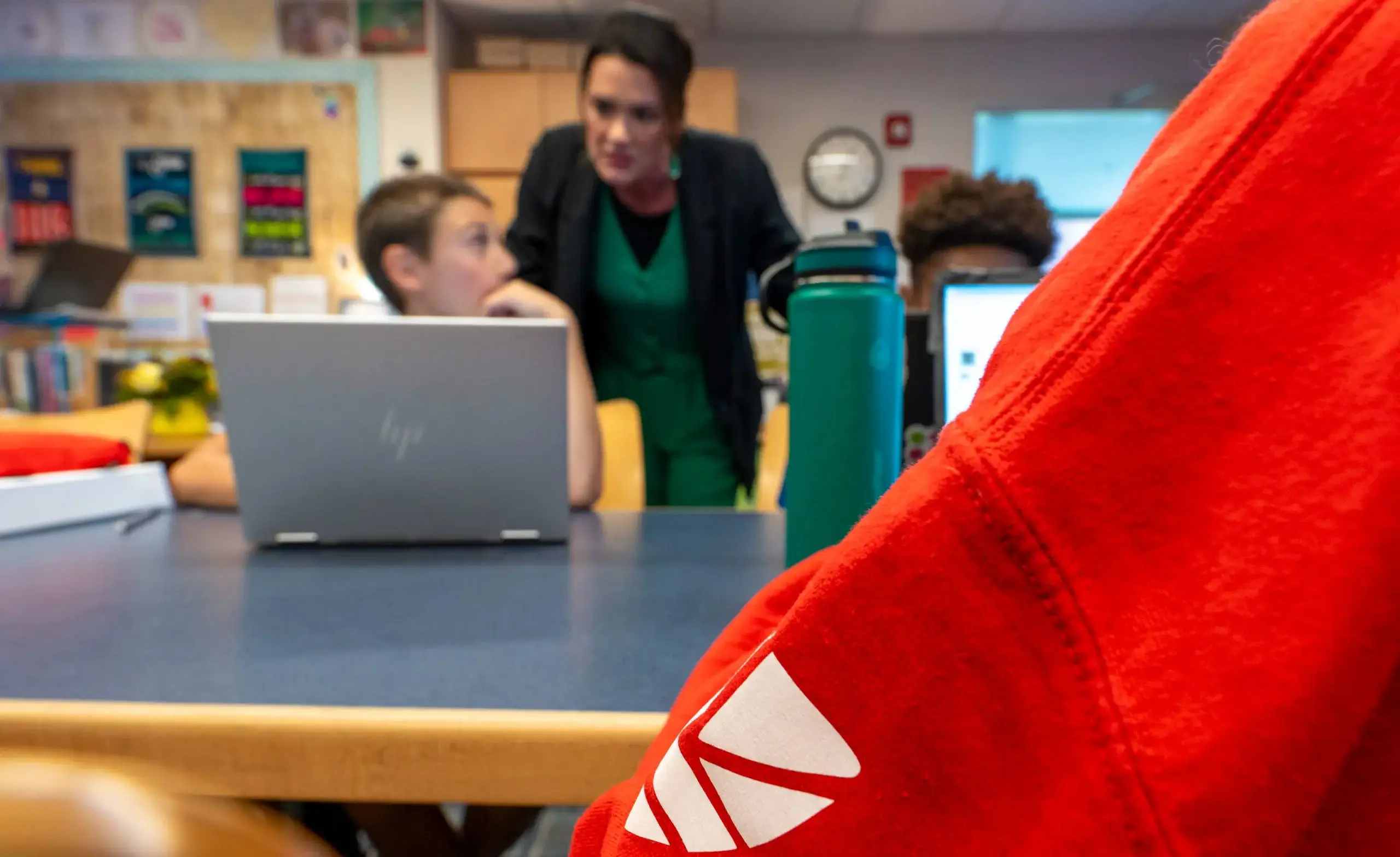 students working in classroom with teacher