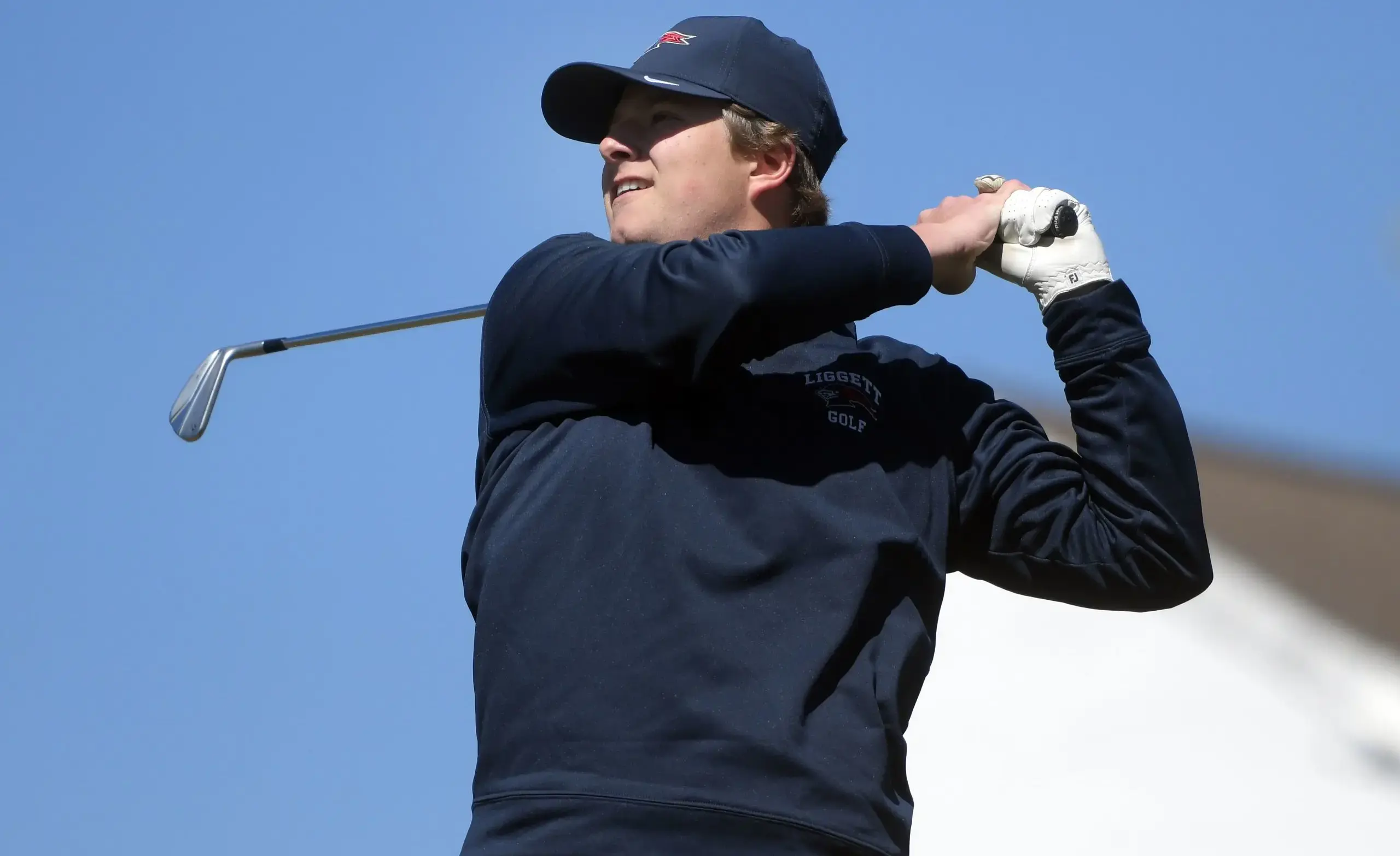 Single golfer swings club
