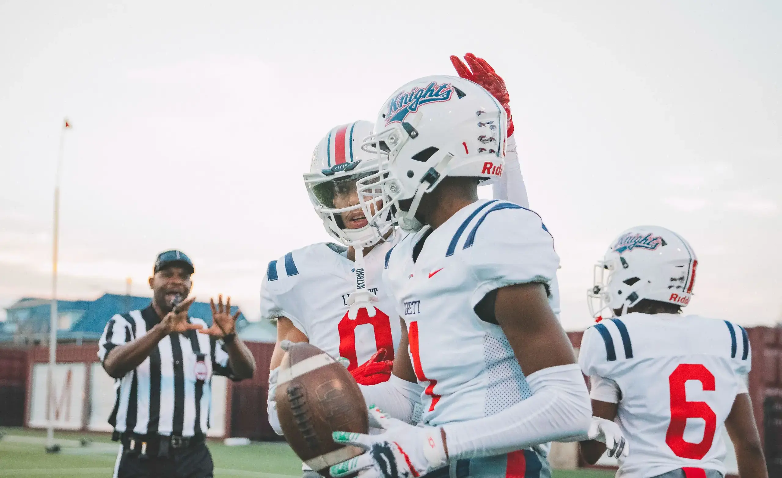 Two football players congratulate each other