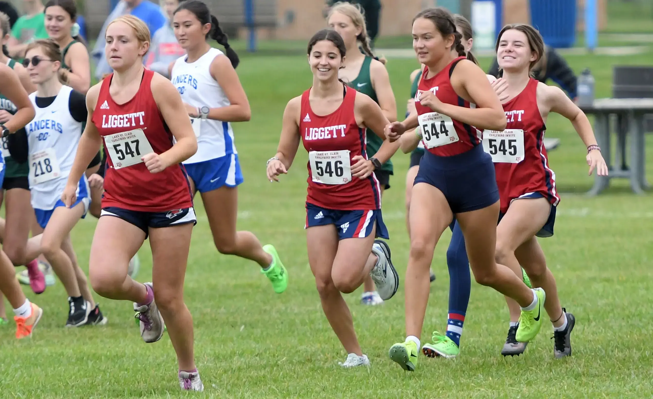 Female cross country team members run