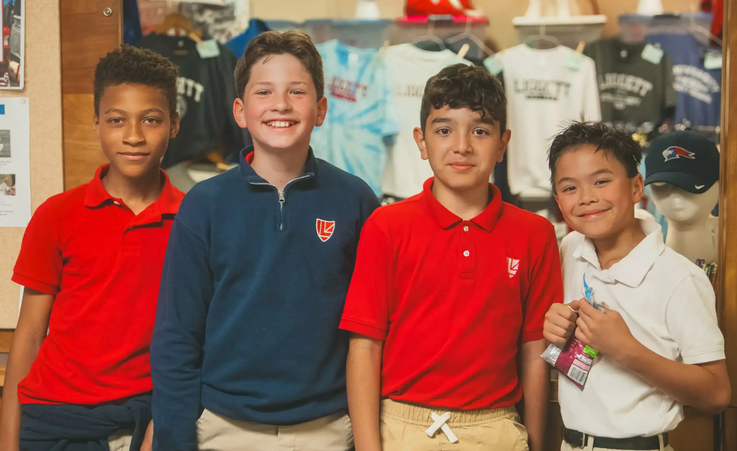 Four ULS Lower School students smile at the camera.