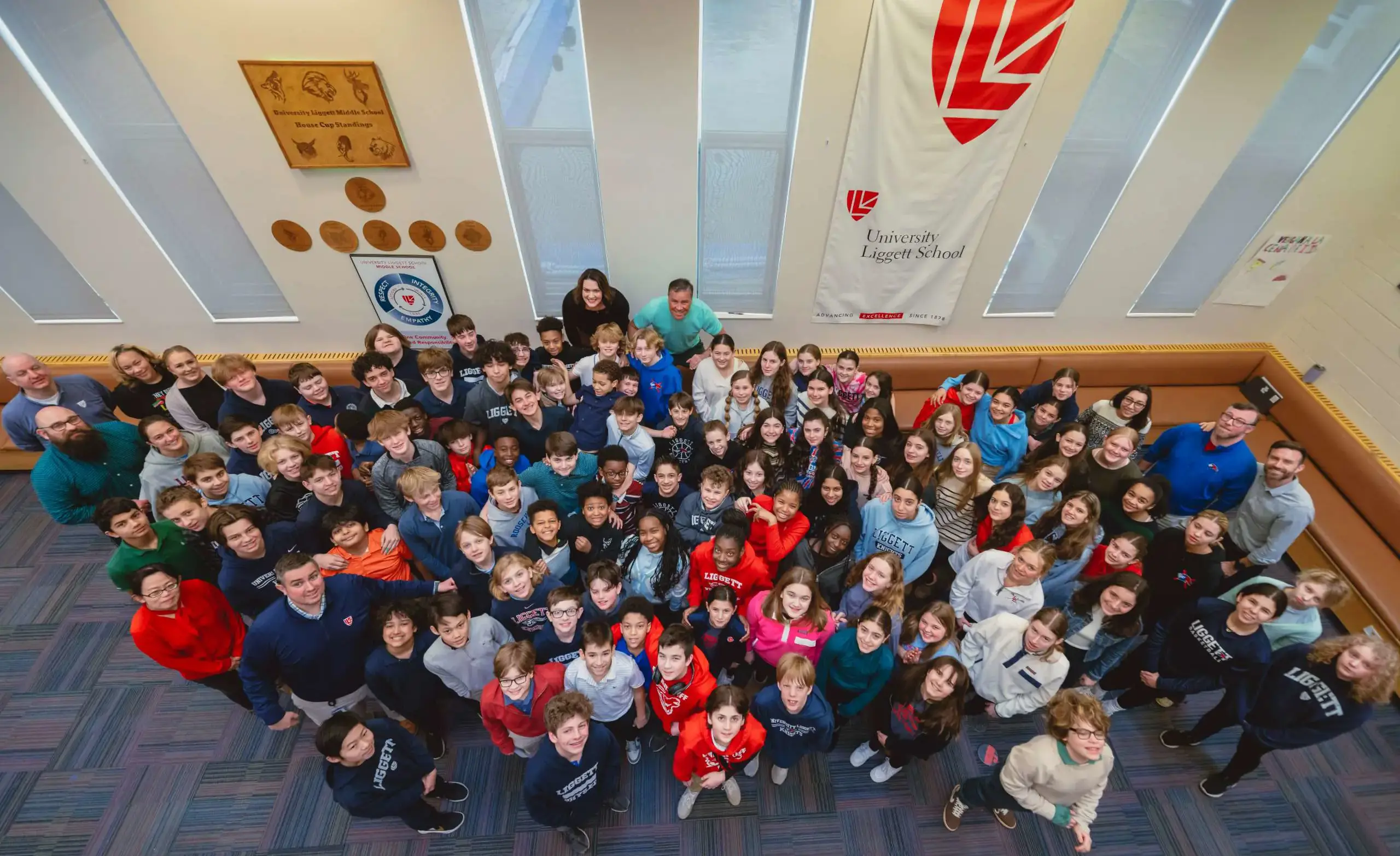 large group of middle school students gathered together in community commons