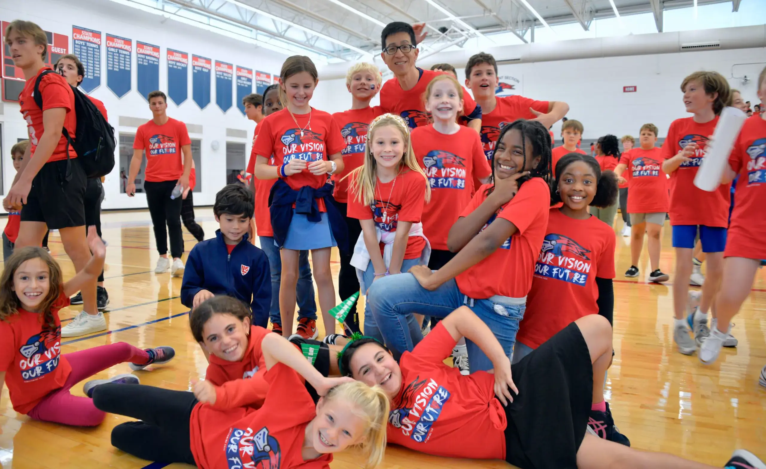 Fourth grade students with teacher wearing Our Vision. Our Future. logo