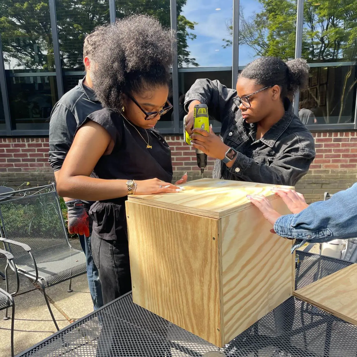 Upper School students creating wooden props as part of the Shakespeare Project.