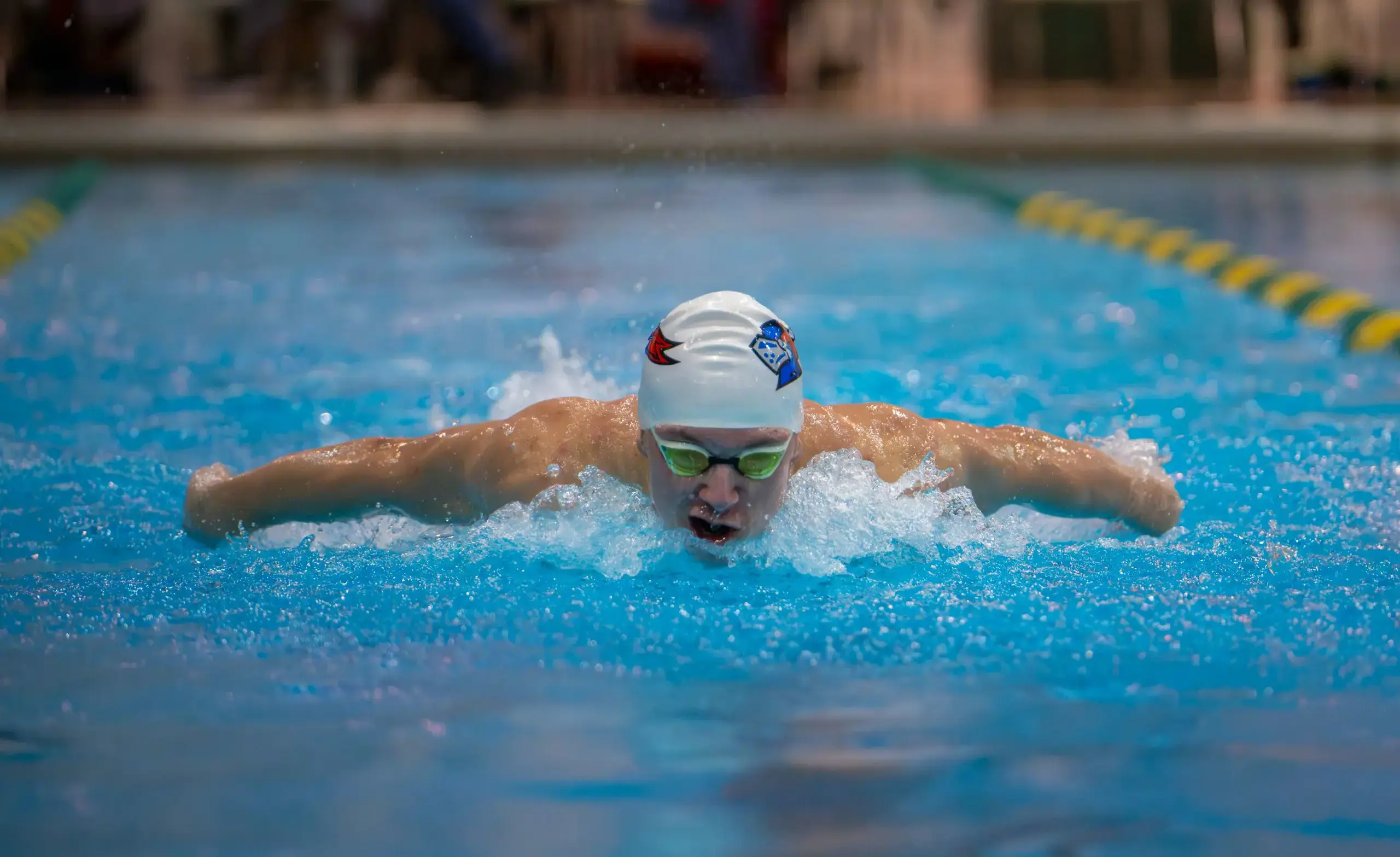 ULS athlete swimming butterfly during meet
