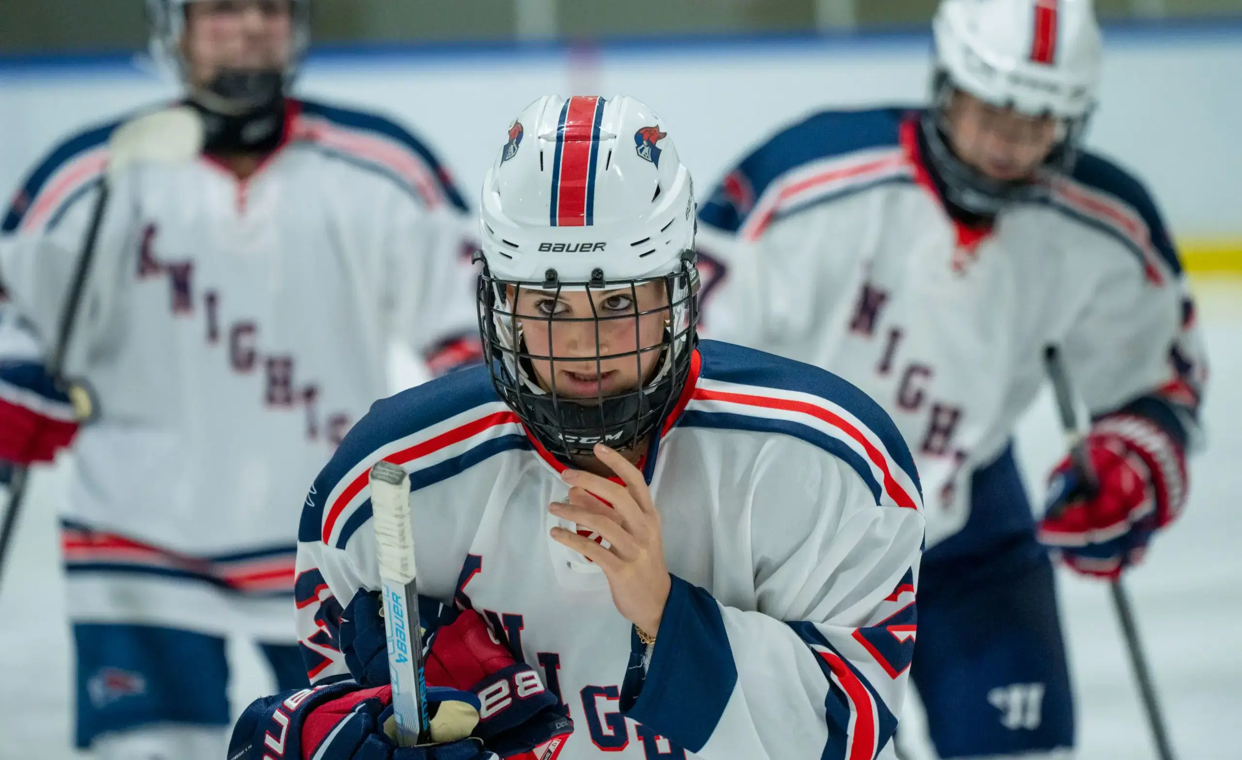 Girls hockey player looks intense on the ice