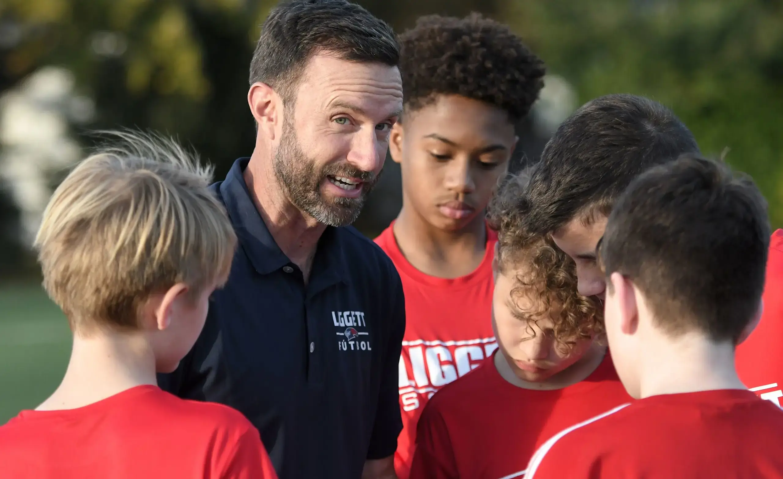 Middle school students with soccer coach.